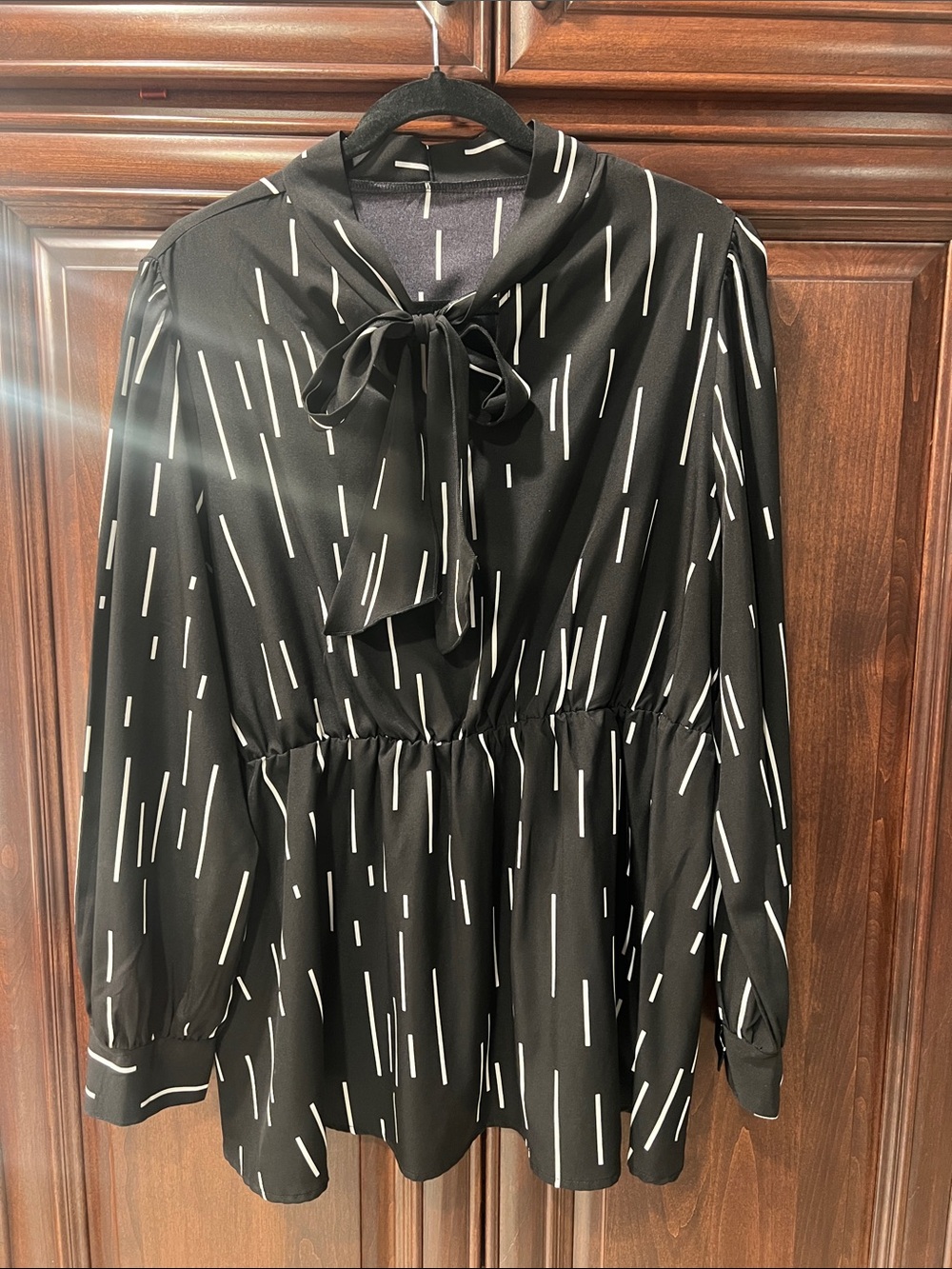 Black Bow-Tie Peplum Blouse with White Dash Print